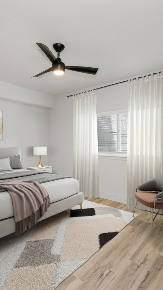 a rendering of a bedroom with a bed and a fan at The Palm Haven